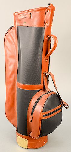 Bottega Veneta golf bag, unused, having brown and black leather exterior, zipper pouches, leather shoulder strap, and dust cover top...