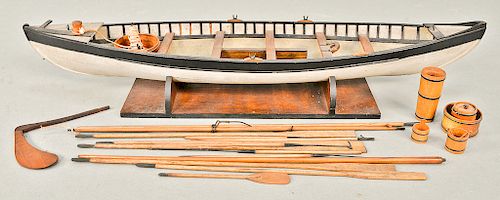 Vintage wooden whaling longboat model, possibly 19th century, complete with harpoons, oars, rope drums, rudder, and drop down keel,...