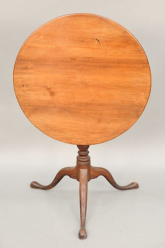Federal cherry tip table on urn carved shaft on tripod base, 19th century.  ht. 29 in., top: 29 1/4" x 29 3/4"
