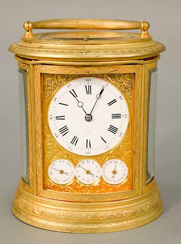 Oval Tiffany & Co. carriage clock, white enameled dial marked: Tiffany & Co. Paris, having four dials, month or date calendar, day o...