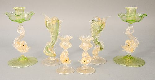 Group of six Venetian figural glass candlesticks including three pairs, each having dolphin supports.  ht. 4 3/4 in. to ht. 8 1/2 in.