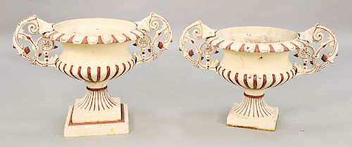 Pair of iron outdoor urns with handles.  ht. 27 in., wd. 36 in.  Provenance: Estate of Stephen M. Serlin of Lake George, New York