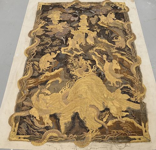 Large silk and gold thread embroidered wall hanging having Buddha, Immortal, and scholar figures surrounded by three clawed dragon,...