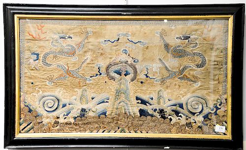 Large framed embroidered textile depicting two opposing five-clawed dragons writhing and vying for the sa...