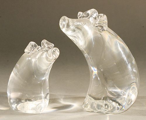 Pair of Steuben glass pig sculptures, designed by Lloyd Atkins, both signed on bottom: Steuben LDA.  ht. 6 1/4 in., & ht. 4 1/2 in...