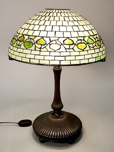 Tiffany Studios "Acorn" table lamp, green leaded glass shade, on triple socket lotus form, bronze base on five ball feet, shade marked: Tiffany Studio