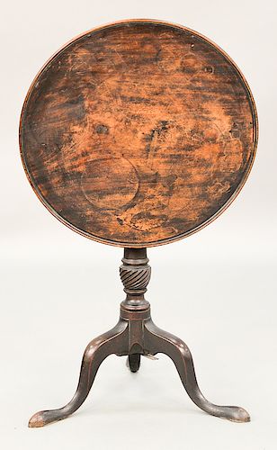 Mahogany tip table with round molded edge top on spiral turned shaft, set on tripod base, circa 1800.  ht. 28 in., 23 3/4" x 24 1/4"