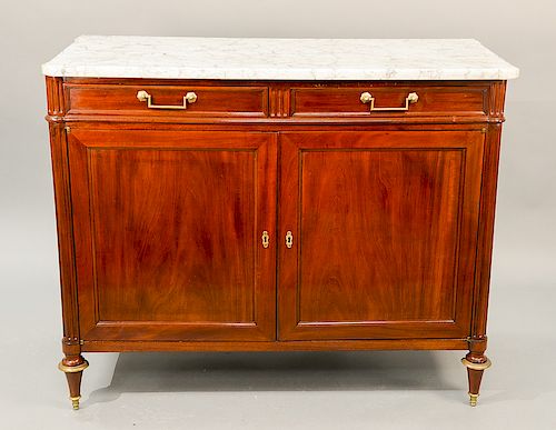 Louis XV style mahogany cabinet having marble top with turret corners, two drawers, and two doors.  ht. 40 in., overall wd. 50 in....