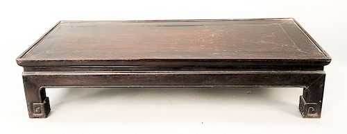 Chinese hardwood rectangular stand with carved feet.  ht. 6 3/4 in., top: 14 1/2" x 31"  Provenance: Estate of Robert Rintoul, G...