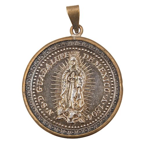 A SILVER MEDAL OF OUR LADY OF GUADALUPE. MEXICO, EARLY 19TH CENTURY.