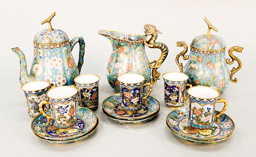 Fifteen piece cloisonne tea set including tea pot, sugar, and pitcher having dragon handle, six cups with white enameled interior an...