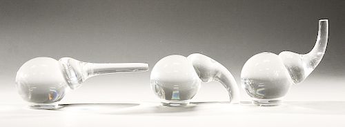 Three Steuben glass elephants figure, designed by Paul Schultz, ca 1980s.  lg. 6 in. to 9 in.  Condition: scratching to bottom,...