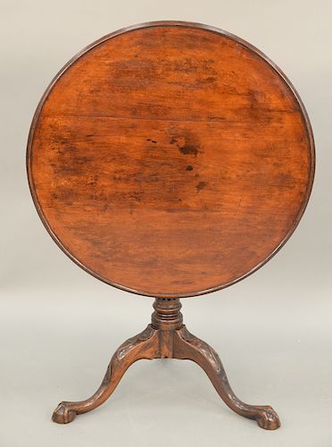 Chippendale mahogany tip and turn table having round dished top on birdcage, set on fluted and turned shaft, on tripod base with vin...