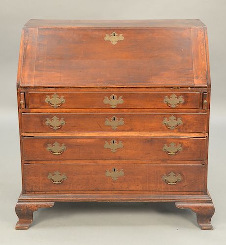 Chippendale cherry desk having slant lid over four drawers, set on ogee feet, interior with fan carved drawer, 18th century.  ht. 42 in., wd....