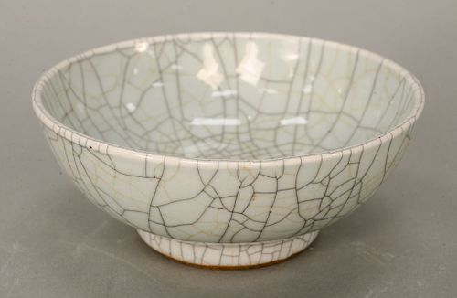 Crackle glazed (Ko or Ge yao) bowl, China, 19th century, the spherical body atop a cylindrical foot.  dia. 7 in.