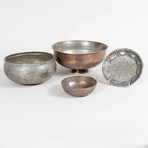 Three Middle Eastern Engraved Metal Bowls and a Similar Plate
