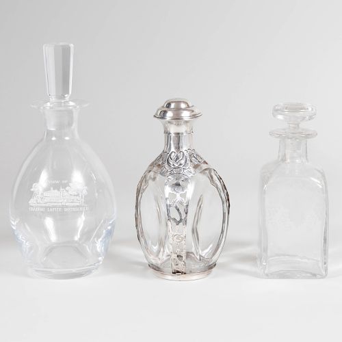 Two Glass Decanters and Stoppers, and a Mexican Silver-Mounted Glass Bottle and Stopper