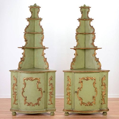 Pair Italian Rococo green painted corner cupboards