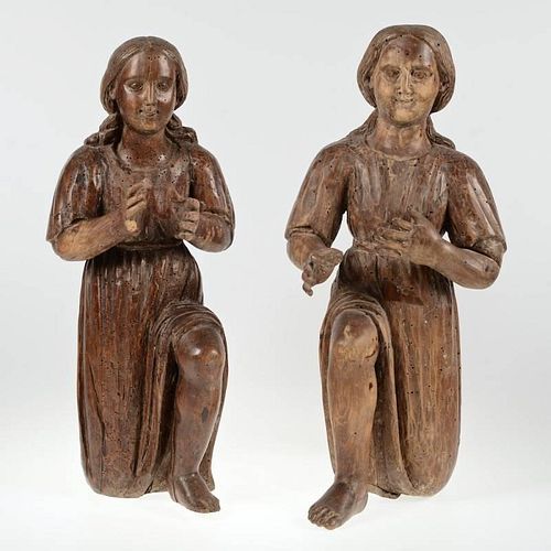 Pair Continental Baroque carved walnut adorants