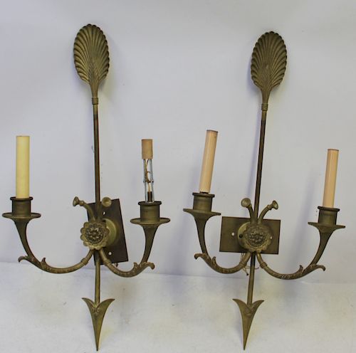 An Antique Pair of Bronze Arrow Form Sconces.