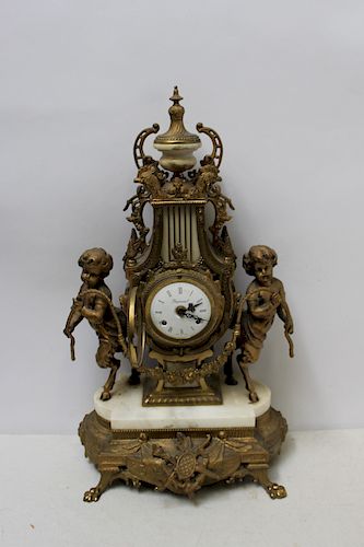 Antique Gilt Metal And Marble Figural Clock.