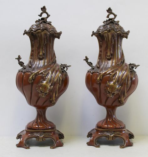 Pair of Patinated Bronze Lidded Urns.