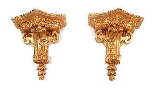 A Pair of French Giltwood Wall Brackets Height 19 x width 17 1/2 x depth 10 inches.