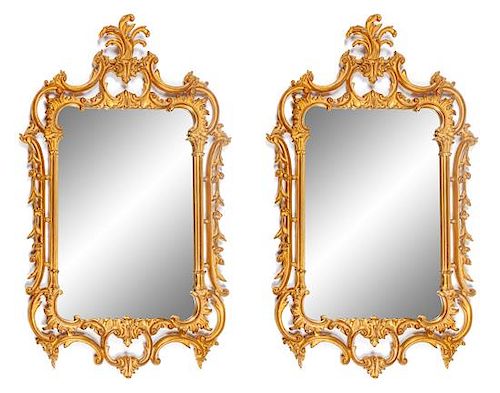 A Pair of Louis XV Style Gilt Mirrors Height 50 x width 29 inches.