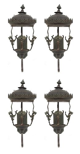A Group of Four Cast Metal Wall-Mounted Lanterns Height 32 inches.