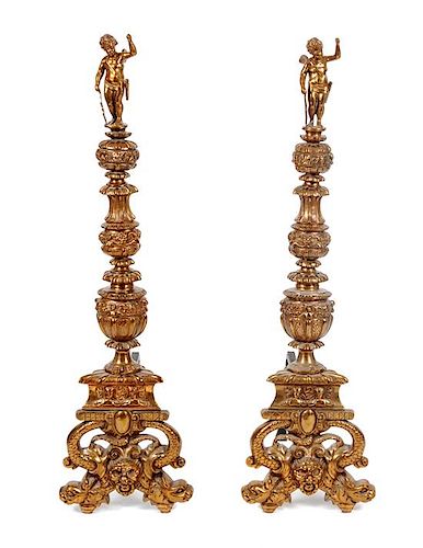 * A Pair of Continental Gilt Bronze Andirons Height 47 inches.