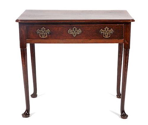 * A Queen Anne Oak Writing Table Height 28 x width 31 3/4 x depth 19 inches.