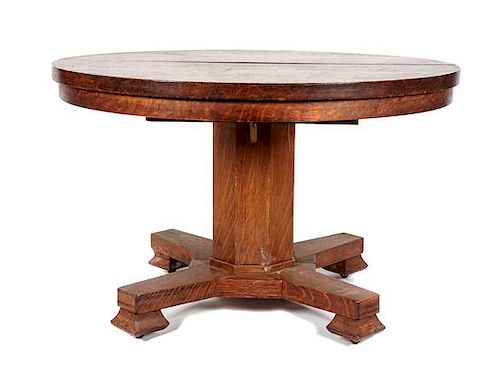 An Arts & Crafts Oak Round Extension Table Height 30 1/2 x diameter 48 inches.