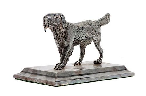 * An American Water Spaniel Cast Metal Figure Height 3 x width 5 1/4 x depth 2 5/8 inches.