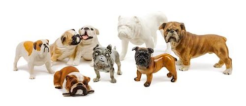 * A Group of Seven Porcelain and Bisque Bulldogs Width of widest 8 1/4 inches.