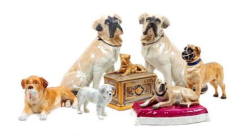 * A Group of Seven Porcelain and Ceramic Mastiff Figures Height 9 1/4 inches.