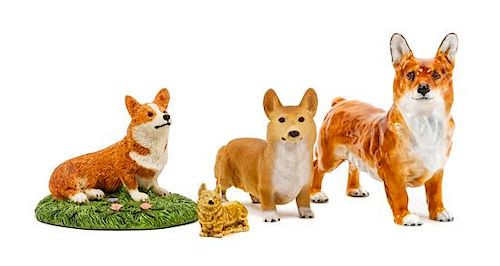 * A Group of Four Pembroke Welsh Corgi Figures Width of widest 5 3/4 inches.