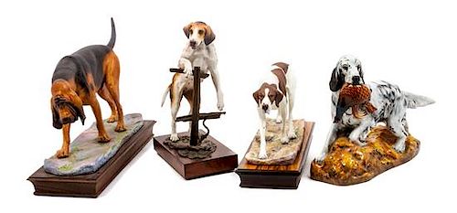 * A Group of Four Dog Figures of Various Breed Width of widest 14 1/2 inches.