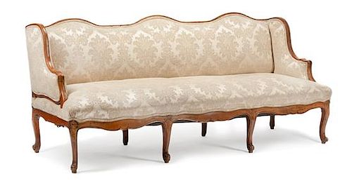 A French Provincial Walnut Sofa Height 37 x width 82 x depth 32 inches.
