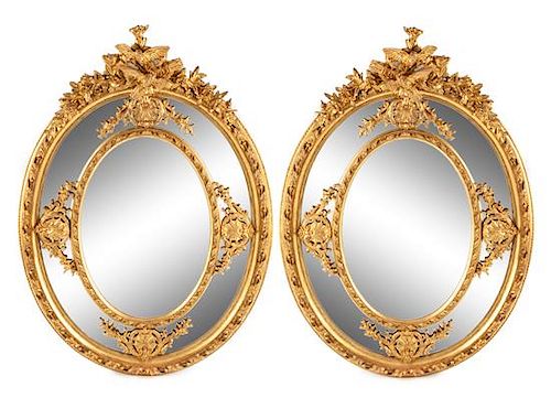 A Pair of Large Louis XV Style Giltwood and Gesso Mirrors Height 73 1/2 x width 53 inches.