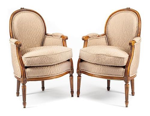 A Pair of Louis XVI Style Walnut Bergeres Height 34 1/2 inches.