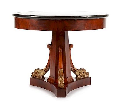 An Empire Style Parcel Gilt Mahogany and Specimen Marble Table Height 29 x diameter of top 36 inches.
