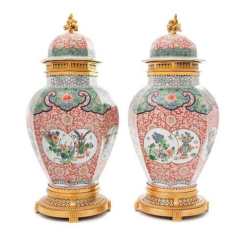 A Pair of French Gilt Bronze Mounted Porcelain Covered Vases Height overall 20 3/4 inches.