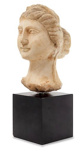 * A Carved Marble Head of a Woman Height 9 1/8 inches.