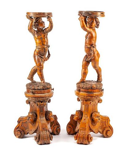 A Pair of Italian Carved Figural Stands Height 50 1/2 inches.