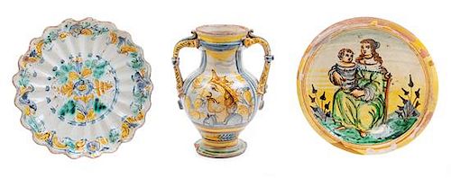 An Italian Majolica Handled Vase and Two Plates Height of vase 10 1/2 inches; diameter of larger plate 11 1/4 inches.
