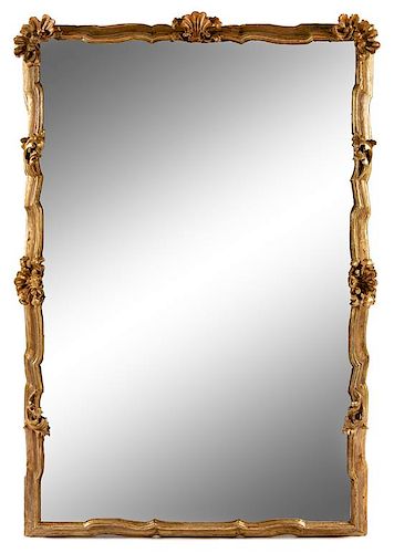 An Italian Baroque Style Giltwood Mirror Height 84 x width 54 inches.
