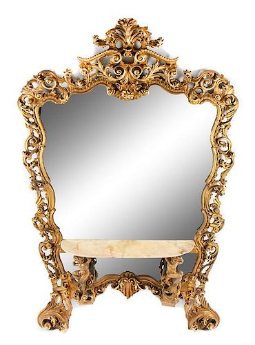 A Large Italian Carved Giltwood and Polychromed Mirror Height 94 x width 62 inches.