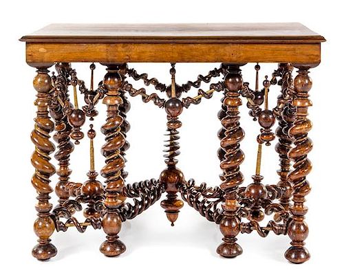 A Continental Carved Walnut Table Height 29 1/4 x width 38 1/2 x depth 25 inches.