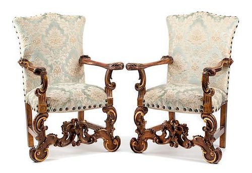 A Pair of Spanish Renaissance Style Painted and Parcel Gilt Armchairs Height 44 inches.