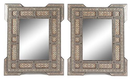 A Pair of Moorish Style Mother-of-Pearl Inlaid Mirrors Height 46 x width 37 1/2 inches.